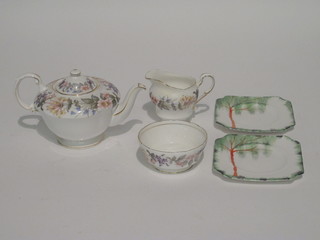 A 21 piece Paragon Country Lane pattern tea service comprising  9 1/2" bread and butter plate, 6, tea plates 6" - 1 cracked,  teapot, cream jug - cracked, sugar bowl, 6 cups and 6 saucers - 1  cup cracked, together with a 7 piece sandwich set - some cracks,