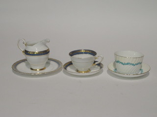 A 20 piece Minton Ardmore pattern tea service comprising sugar bowl, cream jug, 6 tea plates 6", 6 cups and 6 saucers, together  with a 30 piece Tuscan blue and gilt banded tea service  comprising 2 bread and butter plates 9", 12 tea plates 7", 6 cups,  10 saucers and a cream jug