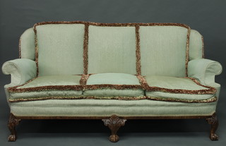 A Queen Anne style walnut show frame 3 seat settee upholstered  in green material, raised on carved cabriole supports 75"