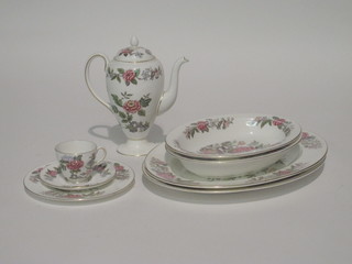 A 104 piece Wedgwood Cathay pattern dinner service comprising  2 oval meat plates 13", pair of oval dishes 10", sauce boat and  stand, 12 dinner plates 10 1/2", 7 side plates 9", 11 tea plates 7",  12 side plates 6", 8 pudding bowls 6", cream jug, sugar bowl -  no lid, 12 coffee cans and 12 saucers - 1 saucer cracked, 9 twin  handled soup bowls - 2 cracked, 12 saucers 6 1/2", some contact  marks