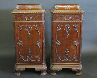 A pair of Georgian style mahogany pedestals with blind fred  decoration fitted a drawer above a cupboard, raised on ogee bracket feet 21" 600-800
