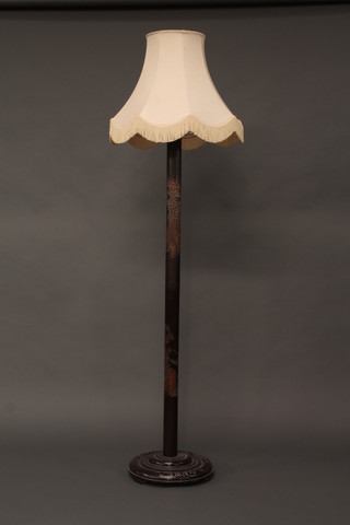 An Oriental carved hardwood standard lamp