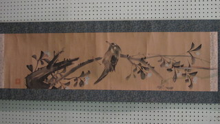 An Oriental print on scroll of a bird 41" x 11" with seal mark