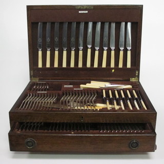 A canteen of Old English and rat tail pattern silver plated  flatware contained in an oak canteen box