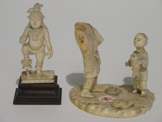 A carved ivory figure of a standing Deity 3" and a carved ivory  figure of a fisherman and boy, f,