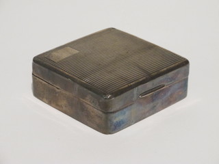A square silver cigarette box with hinged lid, Birmingham 1927,  3"