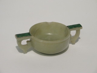An Oriental green hardstone twin handled bowl 2"