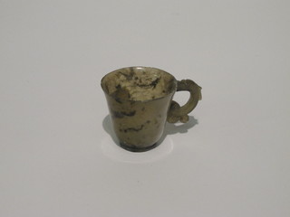 An Oriental green hardstone cup, 2", some chips