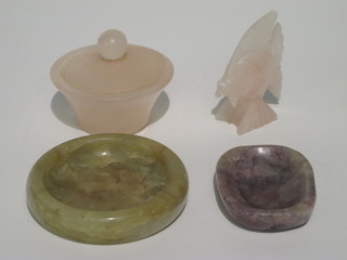 A pink hardstone dish 2", a circular green hardstone dish 3", a hardstone figure of a fish 2" and a hardstone jar and cover 1"