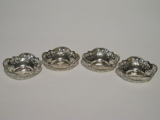 4 circular pierced white metal bon bon dishes