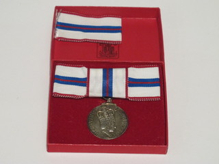 An Elizabeth II 1977 Civil Jubilee medal, ladies issue, cased