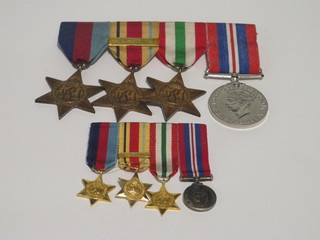 A group of 4 medals comprising 1939-45 Star, Africa Star with  bar 8th Army, Italy Star and British War medal together with  miniatures