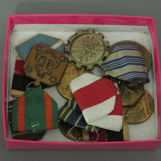 An American WWII European Africa Middle East medal, an  Army Occupation medal, a Korean Service medal, Naval  Achievement medal and 3 others