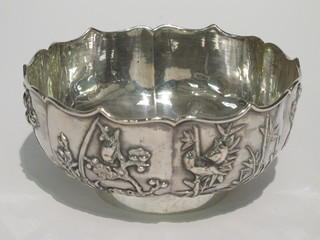 An Oriental silver bowl with embossed decoration, the base marked Canton 11 1/2 ozs