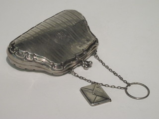 A silver purse Birmingham 1916, marks rubbed, together with a stamp case