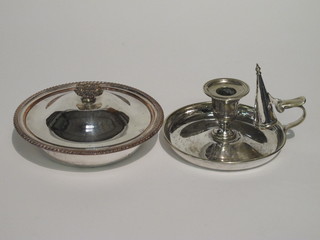 A silver plated chamber stick and a silver plated butter dish and cover