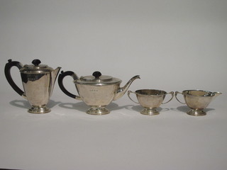 An Art Deco oval silver 4 piece tea service comprising teapot, hotwater jug, twin handled sugar bowl and cream jug,  Birmingham 1932 45 ozs including handles   ILLUSTRATED