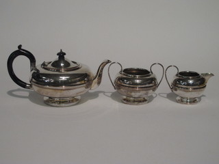 A silver plated 3 piece tea service comprising circular teapot,  sugar bowl and cream jug