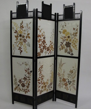A Victorian ebonised 3 fold dressing screen with decorative leaf panels