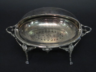 A silver plated roll top butter dish