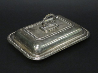 A silver plated entree dish and cover