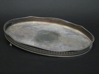 An oval silver plated galleried tea tray 18", 1 foot missing,