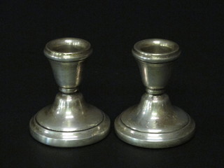 A pair of modern stub silver candlesticks 2 1/2"