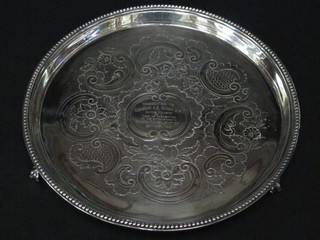 A George IV silver salver with engraved decoration raised on scroll feet, the centre engraved Presented to Alderman A E  Gough JP on The Occasion of Inspection of the Extension to the  Roath Power Station 29 April 1943 11 1/2 ozs