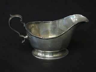 A silver sauce boat raised on an oval foot Birmingham 1933 4  1/2 ozs