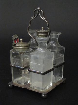 A square silver plated 4 bottle cruet with 4 cut glass bottles, 2 missing stoppers