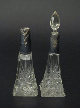 2 square cut glass perfume bottles with silver mounts, 1 stopper missing,