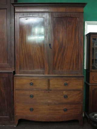 A late Victorian mahogany linen press with moulded and dentil cornice, the interior fitted 4 drawers enclosed by panelled doors,  the base fitted 2 short and 2 long drawers raised on splayed  bracket feet 50"