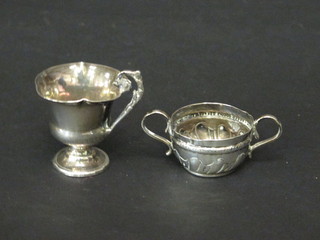 A George III silver miniature twin handled porringer London  1780, base marked TL together with a Continental white metal  thistle shaped cup