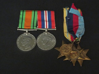 A pair - 2nd World War medal, Defence & War medal together  with a 1939-45 Star, Africa Star and Italy Star