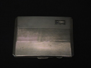 A silver cigarette box with engine turned decoration Birmingham 1945