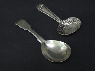 A Georgian silver fiddle pattern caddy spoon London 1822 and a Victorian silver caddy spoon Birmingham 1894,