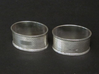 A pair of oval silver engraved napkin rings Birmingham 1935 2  ozs