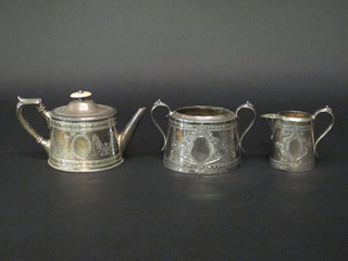 An oval Britannia metal 3 piece tea service comprising teapot,  twin handled sugar bowl and cream jug