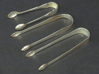 2 pairs of Georgian silver bright cut sugar tongs and 1 other pair of tongs 2 ozs