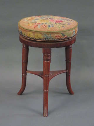 A William IV mahogany revolving adjustable piano stool