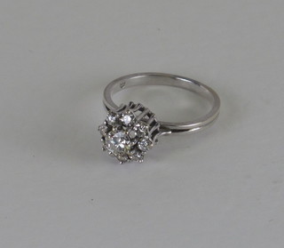 An 18ct white gold or platinum dress ring set diamonds