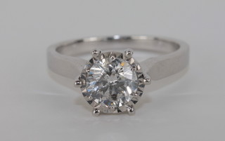 An 18ct white gold dress ring set a round cut solitaire diamond approx 1.02ct