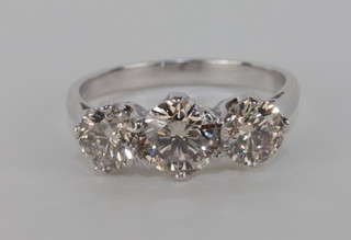 An 18ct white gold dress ring set 3 circular cut diamonds, approx  1.89ct