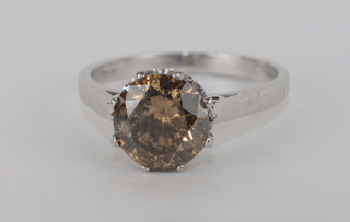 An 18ct white gold dress ring set a cognac coloured diamond, approx 2ct