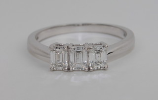 An 18ct white gold dress ring set 3 baguette cut diamonds approx  0.90ct