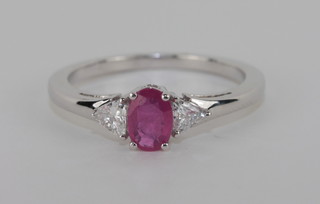 An 18ct white gold dress ring set ruby and diamonds, approx. 0.52/0.22