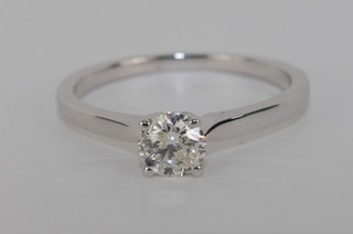 An 18ct white gold dress ring set a diamond approx 0.50ct  complete with certificate