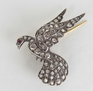 A gold bar brooch in the form of a dove, set diamonds