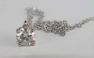 A solitaire diamond pendant, hung on a fine chain, approx 0.75ct