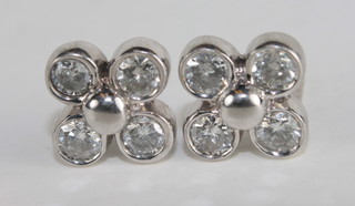 A pair of diamond cluster earrings, approx 0.80ct